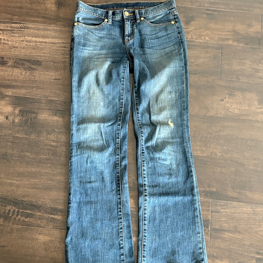 Tory Burch boots cut denim jeans